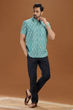 Handwoven men's shirt made from fine-count 2/60s ikat cotton fabric, featuring a single front pocket and a unique blue and white pattern.
