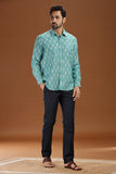 Handwoven men's shirt made from fine-count 2/60s ikat cotton fabric, featuring a single front pocket and a unique blue and white pattern.