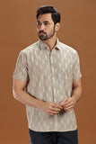Handwoven men's shirt made from fine-count 2/60s ikat cotton fabric, featuring a single front pocket and a unique blue and white pattern.