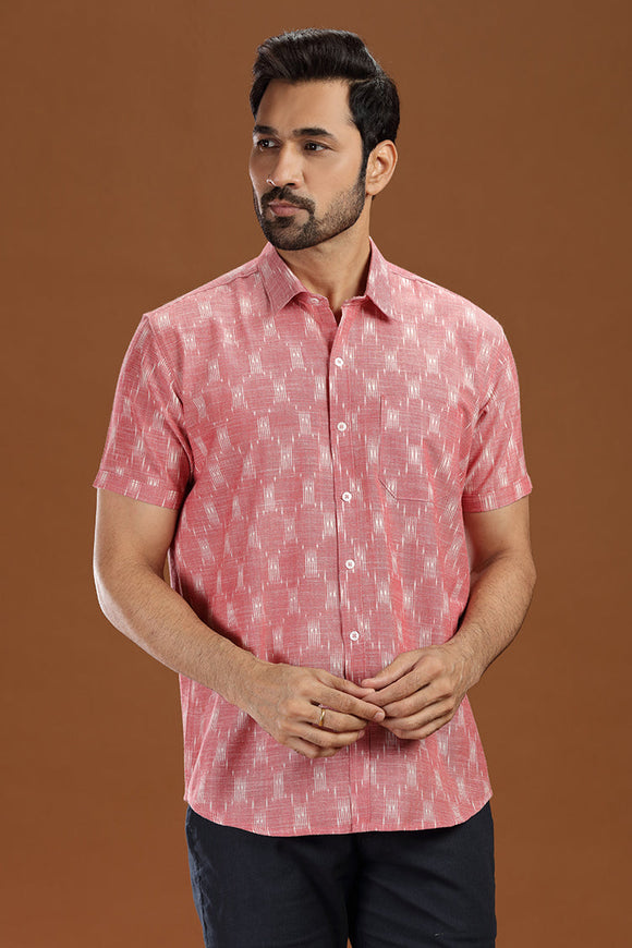 Handwoven men's shirt made from fine-count 2/60s ikat cotton fabric, featuring a single front pocket and a unique blue and white pattern.