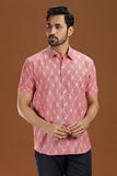 Handwoven men's shirt made from fine-count 2/60s ikat cotton fabric, featuring a single front pocket and a unique blue and white pattern.